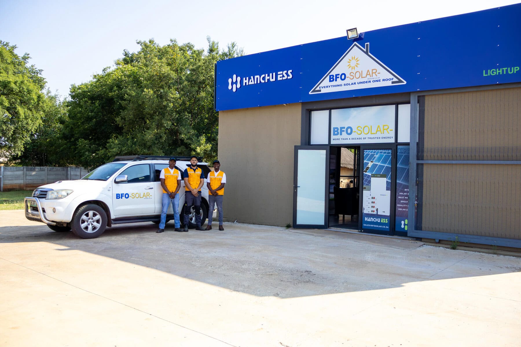 Bfo solar technicians outside at entrance of BFO solar